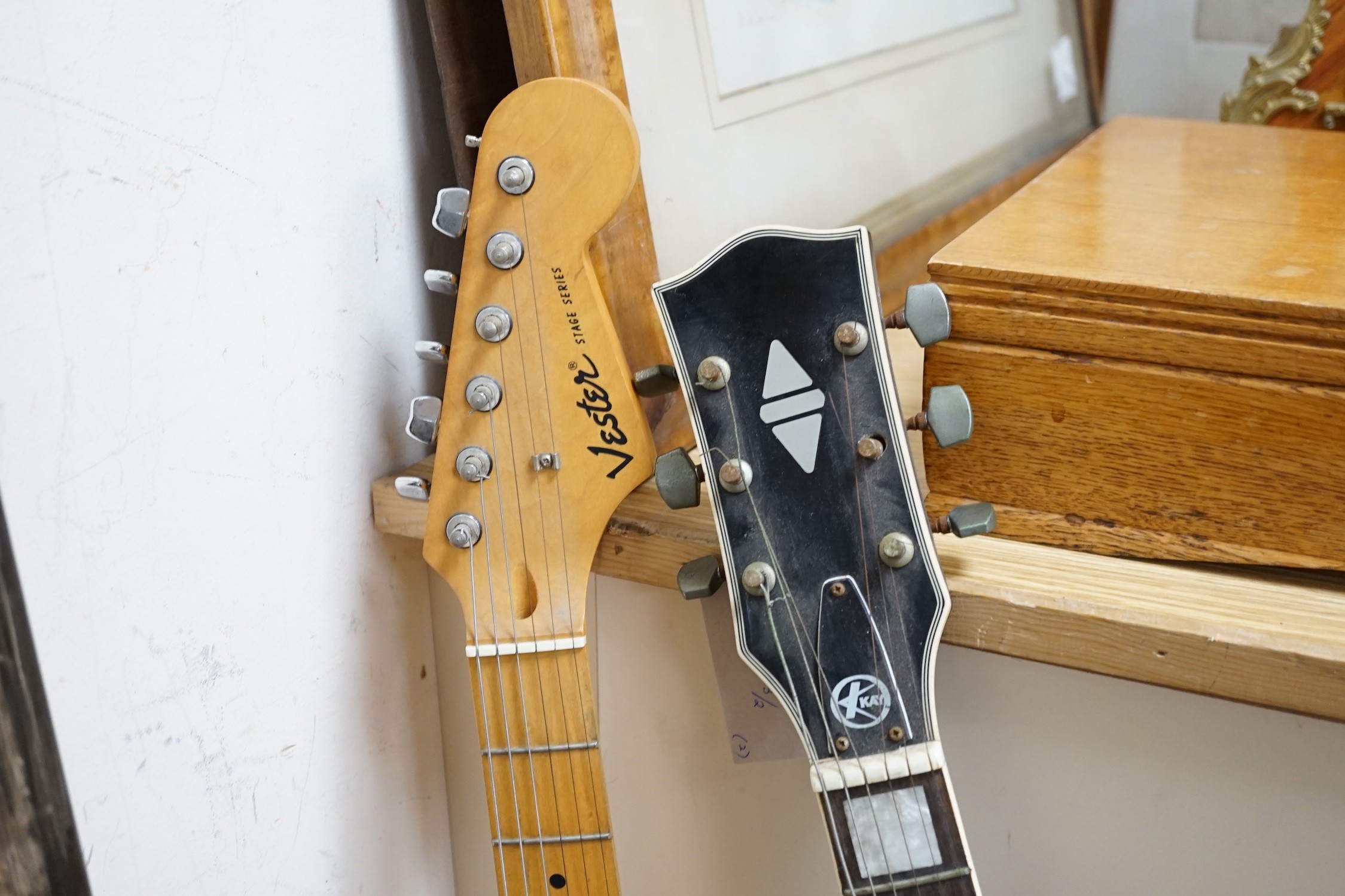 Two electric guitars: a Kay and a Vester Stage series, one soft case